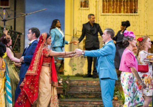 Ashnaa Sasikaran as Eurydice and Nicholas Watts as Orpheus with members of the Orpheus company © Tristram Kenton / Opera North