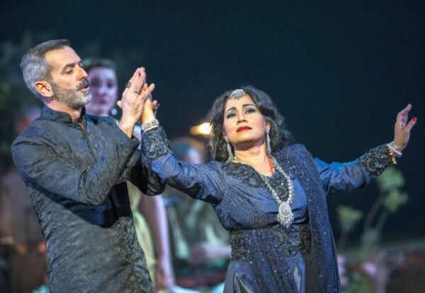 Ashnaa Sasikaran as Eurydice and Nicholas Watts as Orpheus with members of the Orpheus company © Tristram Kenton / Opera North